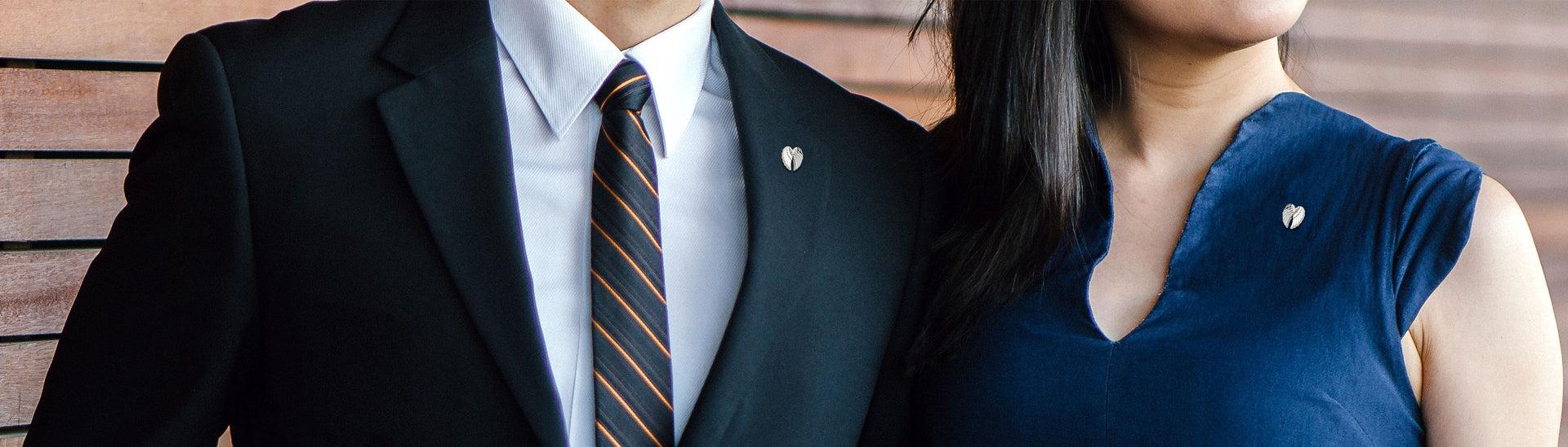 Smart dressed man and woman wearing Angel Wings Pins