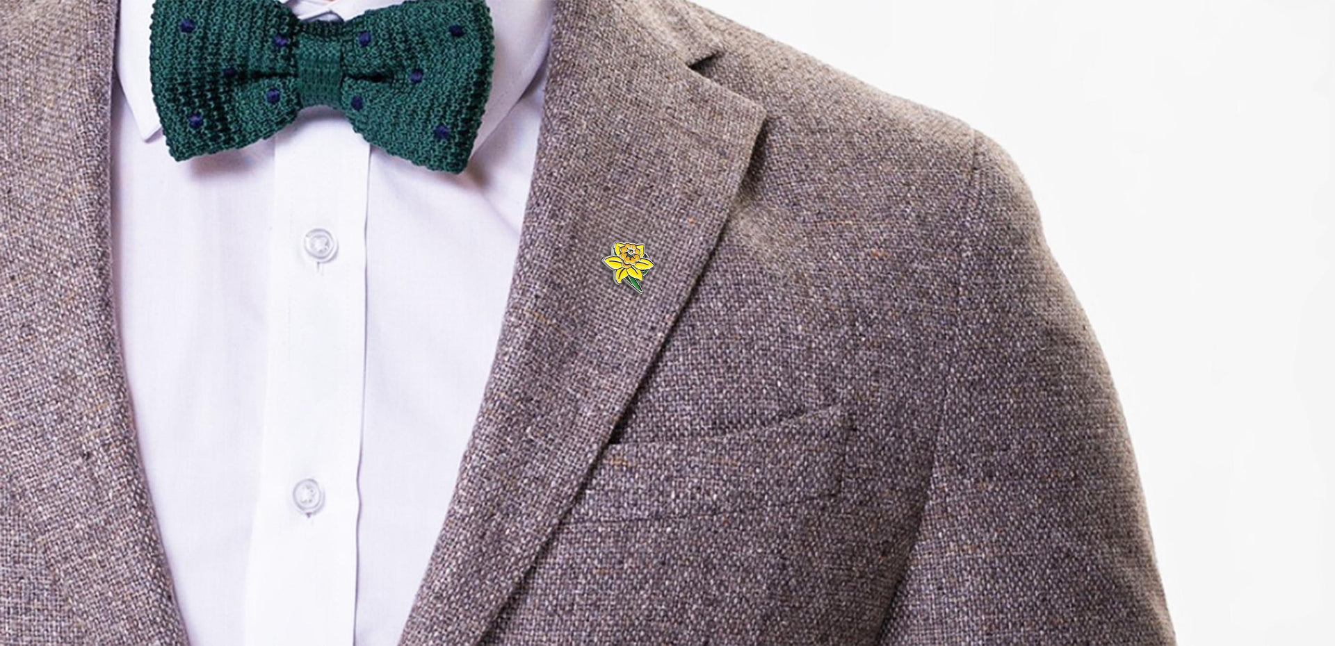 Smart dressed man in bow tie wearing Daffodil Pin